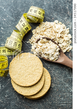 Oatmeal cookies and oat flakes. Oatmeal cookies and oat flakes. 34517990