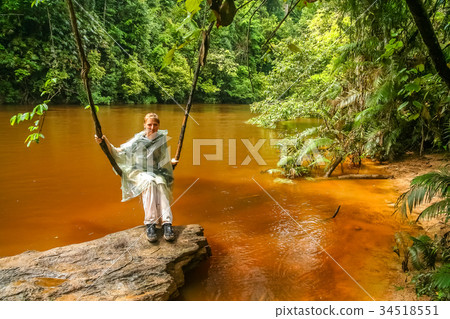 Girl on a jungle swing Girl on a jungle swing 34518551