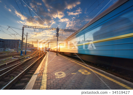 High speed passenger train in motion on railroad 34519427