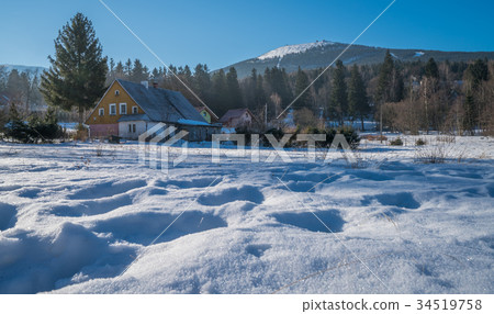 Old house in winter town 34519758