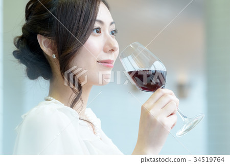 Young woman and wine glass 34519764