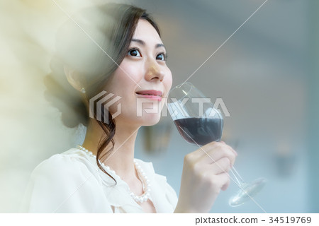 Young woman and wine glass 34519769