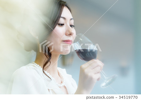 Young woman and wine glass 34519770
