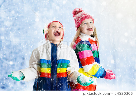 Kids playing in snow. Kids playing in snow. 34520306