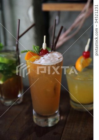 mai tai cocktail with orange cherry fruits on wood background mai tai cocktail with orange cherry fruits on wood background 34521231