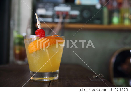 mai tai cocktail with orange cherry fruits on wood background mai tai cocktail with orange cherry fruits on wood background 34521373