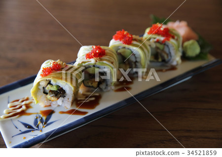 Avocado sushi maki on wood background , Japanese food 34521859