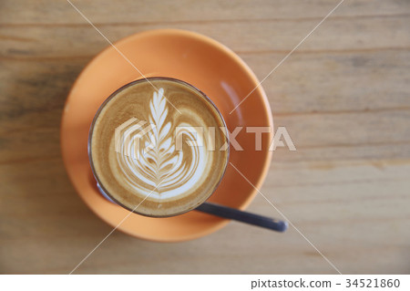 Cappuccino coffee on wood background in coffee shop 34521860