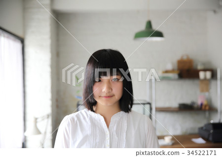 Asian young woman thinking and looking portrait in coffee shop cafe Asian young woman thinking and looking portrait in coffee shop cafe 34522171