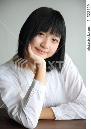Asian young woman thinking and looking portrait in coffee shop cafe Asian young woman thinking and looking portrait in coffee shop cafe 34522299