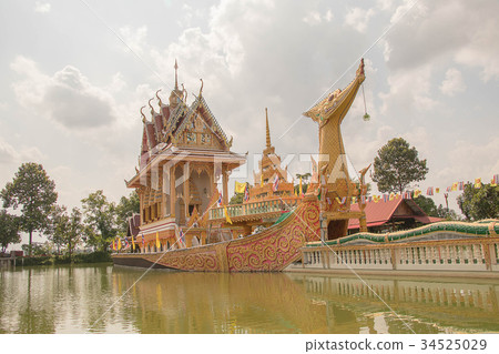 Thai boat shaped church in a small lake. 34525029