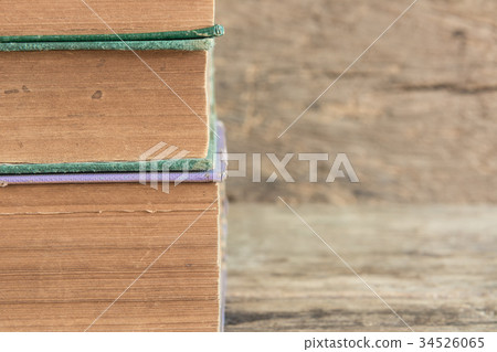 stack of old books on wooden background stack of old books on wooden background 34526065