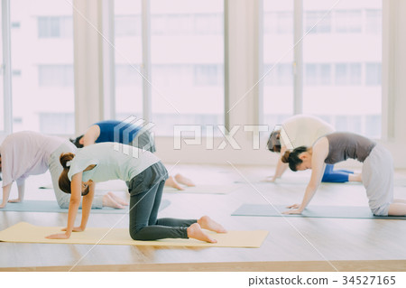 Young woman doing yoga in yoga studio 34527165