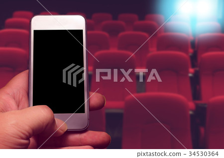 hand holding smartphone with black screen 34530364