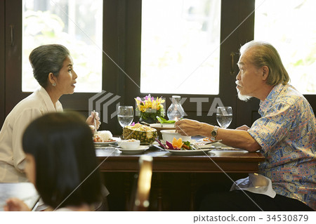 a senior couple is having lunch together in a restaurant 34530879