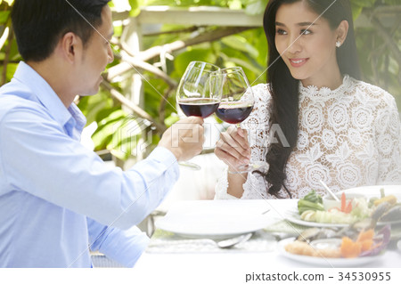 happy couple has a luxury lunch together in restaurant happy couple has a luxury lunch together in restaurant 34530955