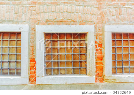 Three windows in old town and texture. Three windows in old town and texture. 34532649