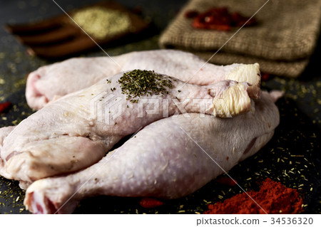 raw chicken legs ready to be cooked 34536320