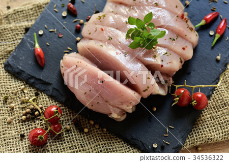 spiced raw slices of turkey breast 34536322
