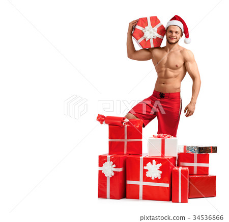 Handsome Santa Claus standing in a pile of 34536866