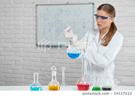 Scientist works with the chemical liquids 34537010