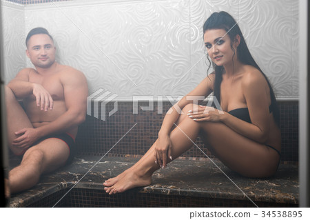 Young attractive couple shot in sauna - Stock Photo [34538895] - PIXTA