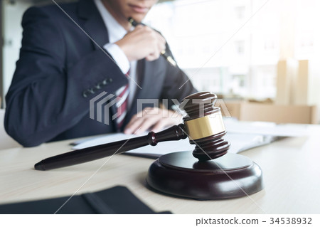 Close up of gavel, Male lawyer working with scales of justice, b 34538932