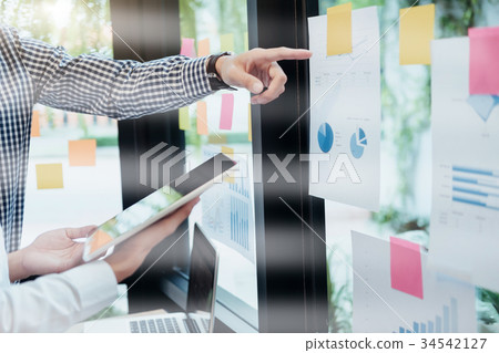 Businessmen teamwork brainstorming meeting. Businessmen teamwork brainstorming meeting. 34542127