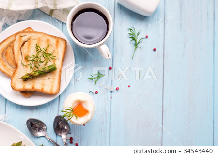Breakfast with egg and a cup of coffee Breakfast with egg and a cup of coffee 34543440