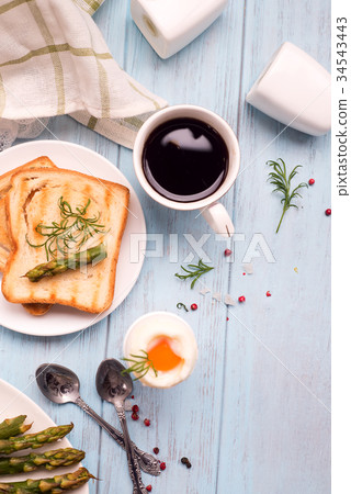 Breakfast with egg and a cup of coffee Breakfast with egg and a cup of coffee 34543443