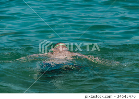 close up on swimming child in the water close up on swimming child in the water 34543476