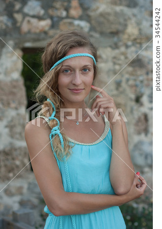 Young blonde woman blue eyes and braided hear  34544242