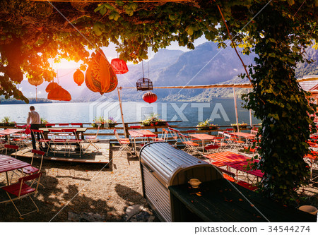 Summer cafe on the shore of a mountain lake 34544274