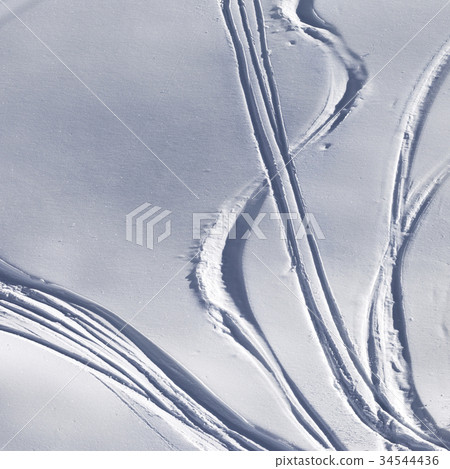 Off-piste slope with track from ski and snowboard Off-piste slope with track from ski and snowboard 34544436