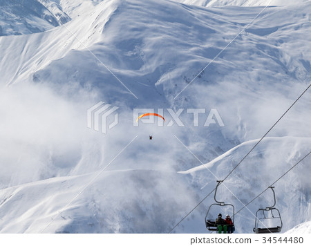 Chair-lift and paraplane on ski resort  34544480