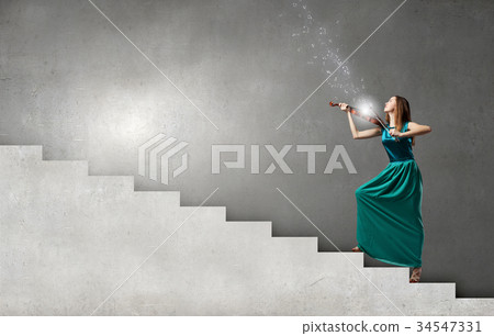 Elegant violinist player 34547331
