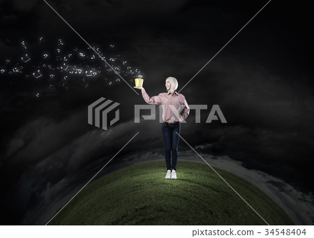 Woman splashing music notes from bucket 34548404