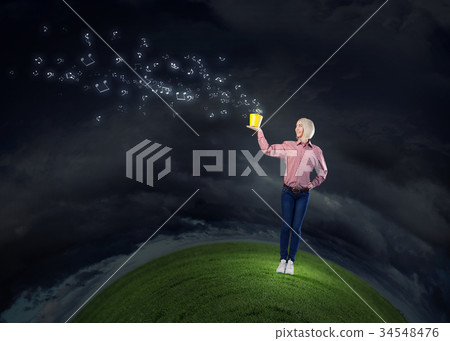 Woman splashing music notes from bucket 34548476