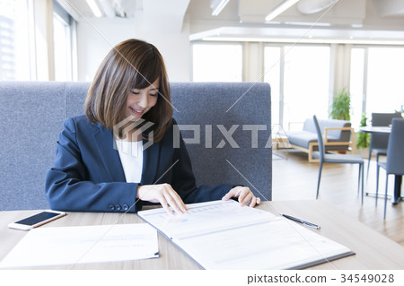 Young woman working Young woman working 34549028