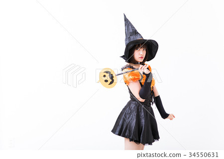 Girl doing witch cosplay at Halloween 34550631