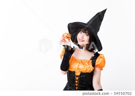 Girl doing witch cosplay at Halloween 34550702