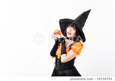 Girl doing witch cosplay at Halloween 34550703