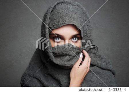 beautiful arab woman covers her face 34552844