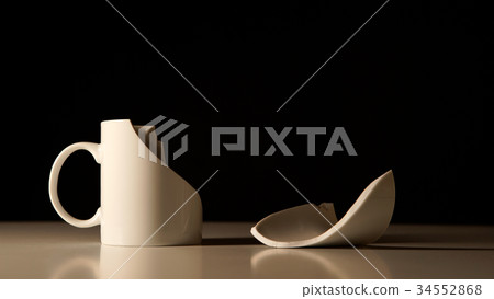 Broken White cup and splinter beside her Broken White cup and splinter beside her 34552868