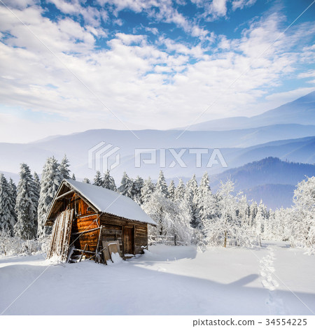 beautiful wooden house in a winter beautiful wooden house in a winter 34554225