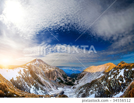 Mountain peaks covered with snow Mountain peaks covered with snow 34556512
