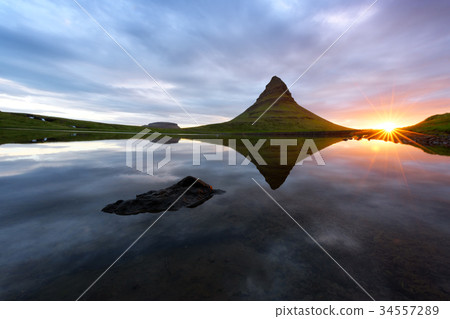 Colorful sunrise on Kirkjufellsfoss waterfall 34557289