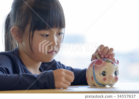 Girl and pig money box 34557637