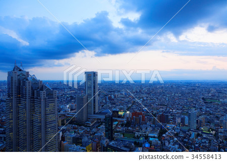 Shinjuku Park Tower and Tokyo Opera City at dusk 34558413