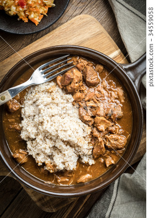 Barley groats with stewed meat. Barley groats with stewed meat. 34559058